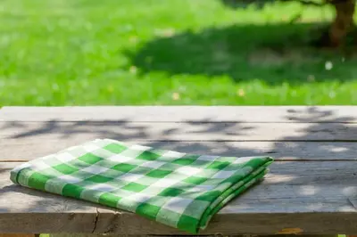 a green and white napkin sitting on a wooden table at Extended Stay America Suites - Fort Lauderdale - Davie in Davie