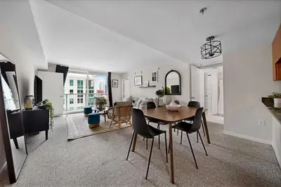 a dining room and living room with a table and chairs at Great 2 Bedrooms in Brickell in Miami
