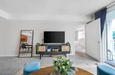 a living room with a large mirror and a tv at Great 2 Bedrooms in Brickell in Miami