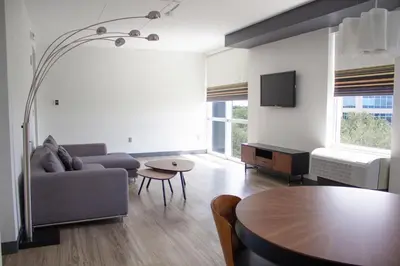 a living room with a couch and a table at Aloft Miami Doral in Miami