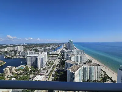 an aerial view of a beach with buildings and the ocean at Lyfe-3308 in Hollywood
