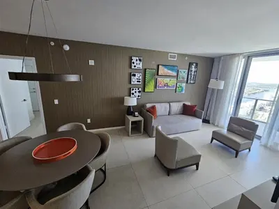a living room with a table and a couch at Lyfe-3308 in Hollywood