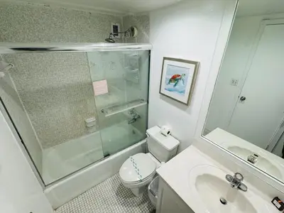 a bathroom with a shower and a toilet and a sink at Miami Hollywood Condo for 4 People 001-21vic in Hollywood