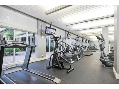 a gym with a row of treadms and cardio machines at Miami Hollywood Condo for 4 People 001-21vic in Hollywood