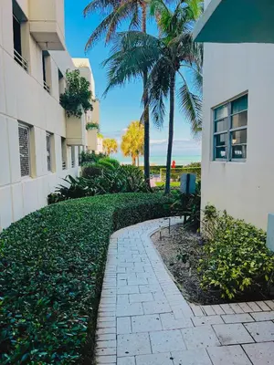 a walkway in front of a building with palm trees at Miami Hollywood Great 2 Bedroom with Garden View 001-22bmar in Hollywood