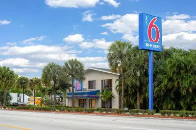 a sign for a walmart on the side of a road at Motel 6-Fort Lauderdale, FL in Fort Lauderdale