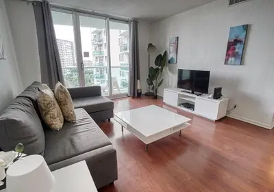 a living room with a couch and a coffee table at Hallandale Beach Intracoastal View Apartments in Hollywood