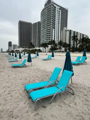 a group of chairs and umbrellas on a beach at Miami Hollywood Bay View on the Beach 002-1bvic in Hollywood