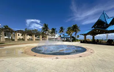 a fountain in the middle of a plaza with palm trees at Hollywood Sunrise in Hollywood
