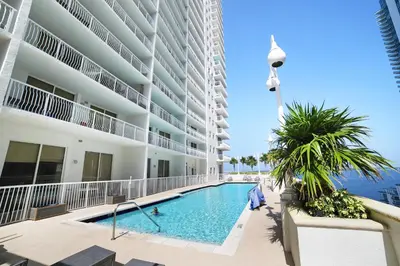 a swimming pool in front of a building at Miami Downtown City view 3BR Air Hockey &Ping Pong table in Miami
