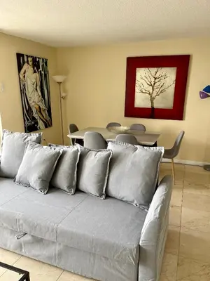 a living room with a couch and a table at Miami Downtown City view 3BR Air Hockey &Ping Pong table in Miami