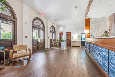 a large room with a lobby with wooden floors and doors at The Landon Bay Harbor-Miami Beach in Miami Beach