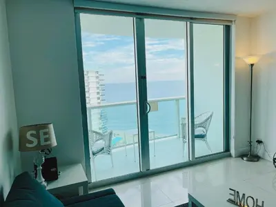 a living room with a large window with a view of the ocean at Excellent Hollywood 2BD Condo 0012-21mar in Hollywood