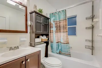 a bathroom with a toilet and a sink and a shower at The oasis near the cruise & airport - By Avi in Fort Lauderdale