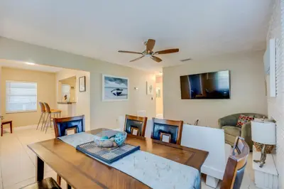 a dining room and living room with a table and chairs at The oasis near the cruise & airport - By Avi in Fort Lauderdale