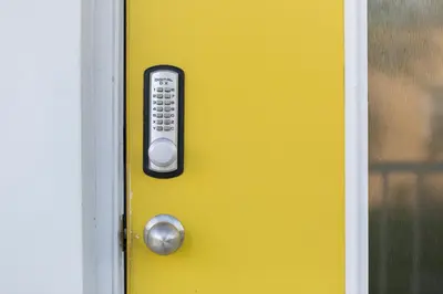 a remote control on a yellow door at Spectacular view on the canal, Fort Lauderdale, very clean, free Parking & Wifi in Fort Lauderdale