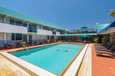 a swimming pool in the middle of a building at Quality Inn Miami South in Kendall