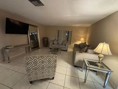 a living room with a couch and a table at 82-10SW 135AV in Miami