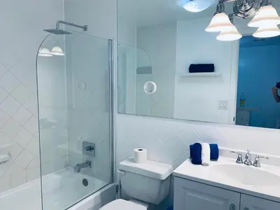 a bathroom with a toilet and a shower and a sink at Beachfront Ocean Dr white sand paradise SoBe 311 in Miami Beach