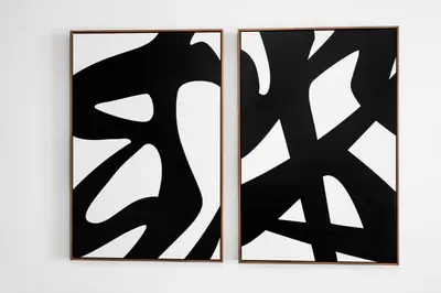 two pieces of black and white art on a wall at Luxurious Condo in Brickell with Free Parking in Miami