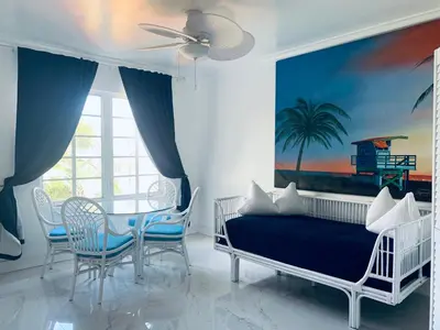 a bedroom with a bed and a table and chairs at vacation home-ocean view SoBe 318 in Miami Beach