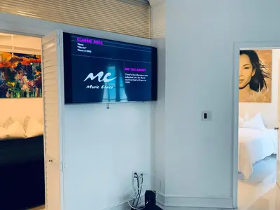 a tv on a wall in a room with a bed at vacation home-ocean view SoBe 318 in Miami Beach
