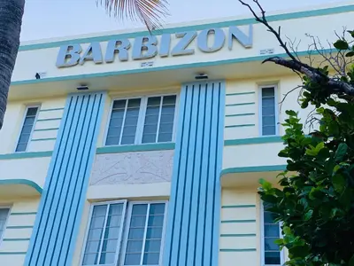 a building with a sign on the side of it at Beach house -magic SoBe 209 in Miami Beach