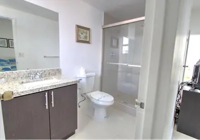 a bathroom with a toilet and a sink and a shower at Miami Hollywood Two Bedroom Penthouse With Intracoastal View 005-22bvic in Hollywood