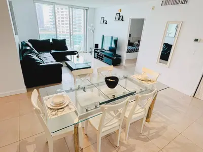 a living room with a glass table and chairs at Miami Hollywood Awesome 2 Bedroom 2 Bathroom 003-22bvic in Hollywood