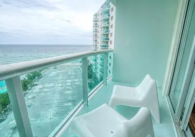 a balcony with a view of the ocean at Miami Hollywood Great 2BD Condo 009-21mar in Hollywood