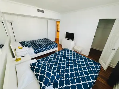 a hotel room with two beds and a television at Miami Hollywood Great 2BD Condo 009-21mar in Hollywood