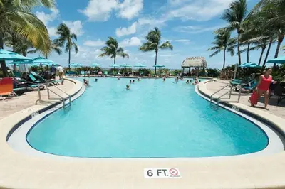 a swimming pool at a resort with people in it at Miami Hollywood Great 2BD Condo 009-21mar in Hollywood