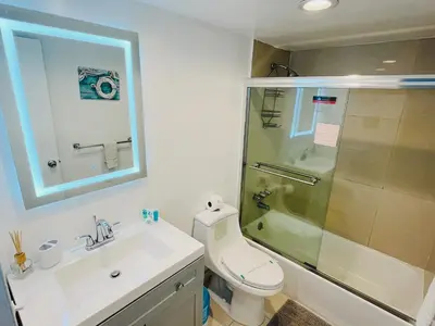 a bathroom with a toilet and a sink and a shower at Miami Hollywood 2 Bedroom on the Beach 007-21mar in Hollywood