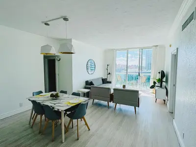 a dining room and living room with a table and chairs at Miami Hollywood Great Two Bedroom Apartment with Channel View 006-22bvic in Hollywood