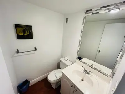 a bathroom with a sink and a mirror at Hollywood 2 Bedroom with Ocean View 004-21mar in Hollywood