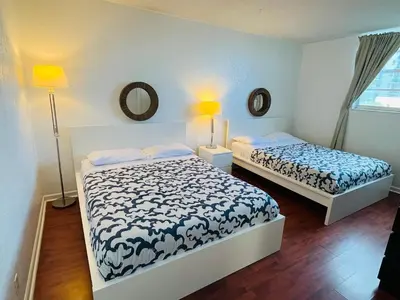 a bedroom with two beds and a mirror at Hollywood 2 Bedroom with Ocean View 004-21mar in Hollywood