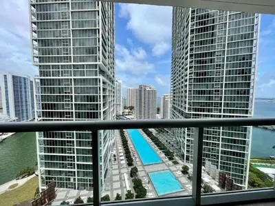 a view from a balcony of a city with tall buildings at Iconbrickell in Miami