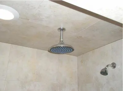 a shower with a ceiling with a light on it at Miami Princess Hotel in Miami