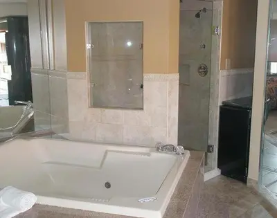 a bathroom with a bath tub and a shower at Miami Princess Hotel in Miami