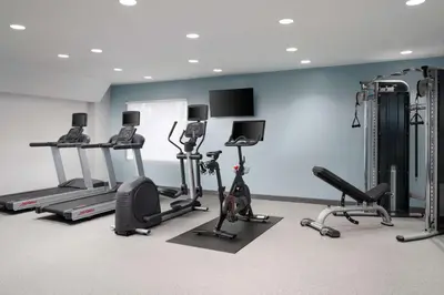a gym with several exercise bikes and tread machines at Home2 Suites by Hilton Miramar Ft. Lauderdale in Miramar