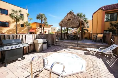 a patio with a grill and a table and chairs at Hollywood Sands Resort in Hollywood
