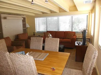 a living room with a table and a couch at Hollywood Sands Resort in Hollywood