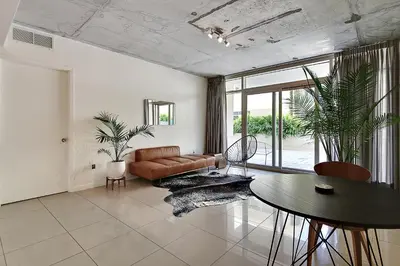 a living room with a couch and a table at Miami Midtown Luxury Apartment in Miami