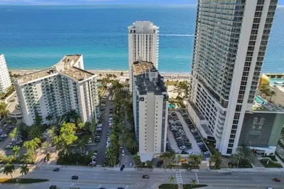 an aerial view of a city with tall buildings and the ocean at Luxury Beachfront Apartments 4001 S Ocean Dr in Hollywood