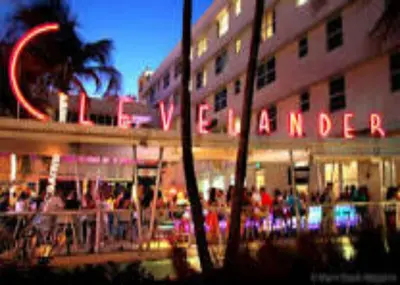 a group of people standing outside of a hotel at 2 Bedroom 2 Bath With Patio On 11th Collins ave in Miami Beach
