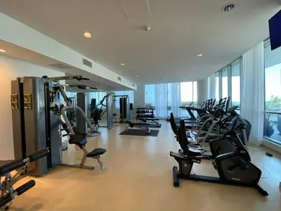 a gym with a bunch of cardio equipment in a building at Monte Carlo Miami Beach in Miami Beach