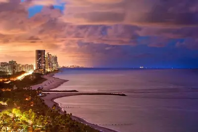 a view of the beach at night at The St. Regis Bal Harbour Resort in Miami Beach