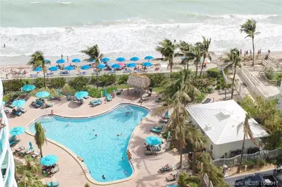 an aerial view of a resort with a swimming pool and the beach at The Tides Miami in Miami