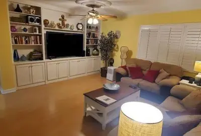 a living room with a couch and a table at Large Lush Oasis Paradise by FLL Beach and Galleria - 2bd 2ba in Fort Lauderdale