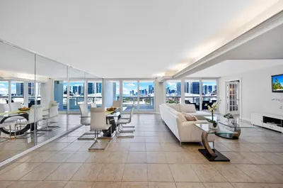 a living room with a couch and a table at StayCozy Apartments at The Grand in Miami